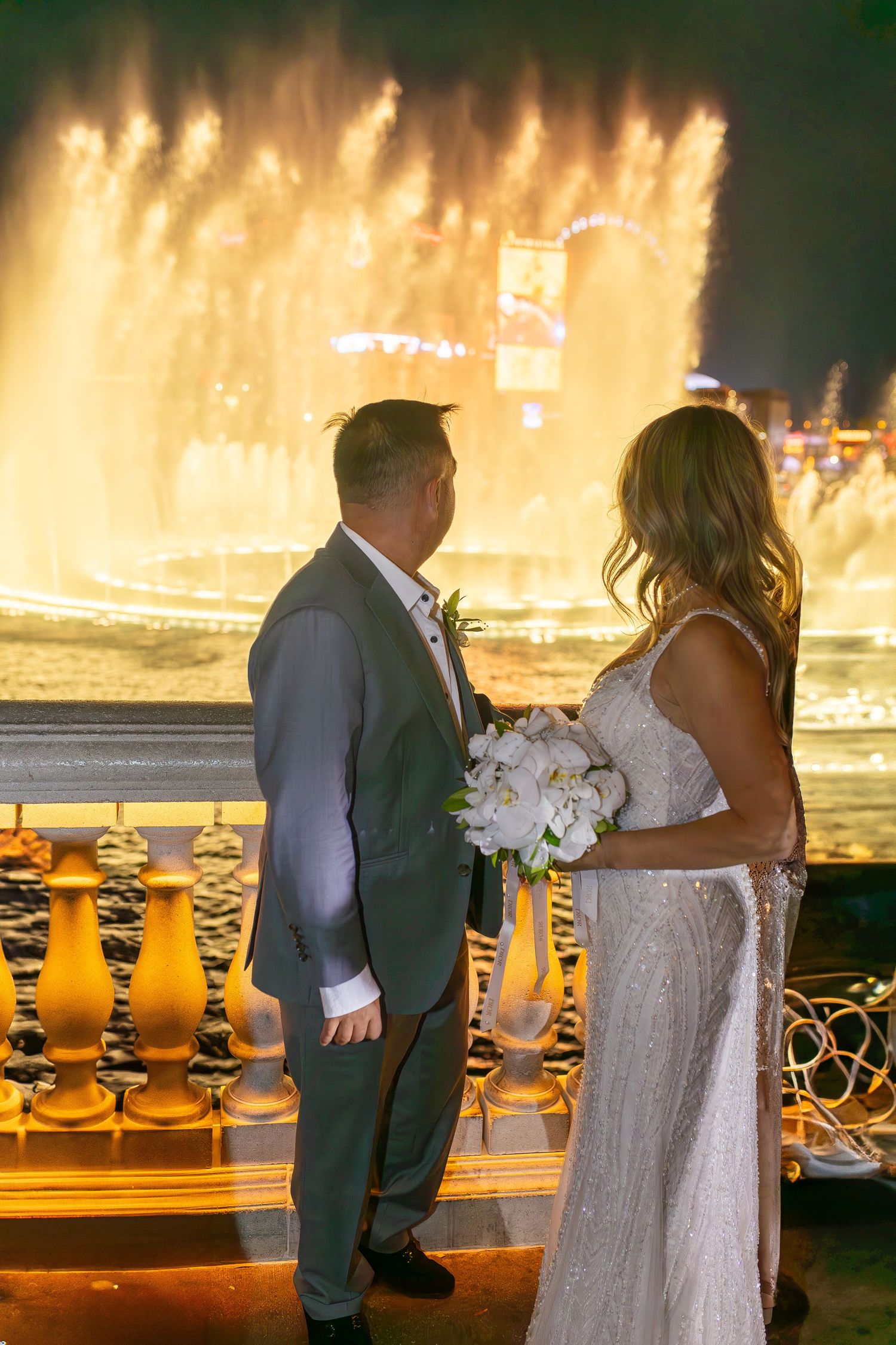 Bride and groom celebrating their elopement at the Las Vegas Bellagio Fountains-Las Vegas photographer
