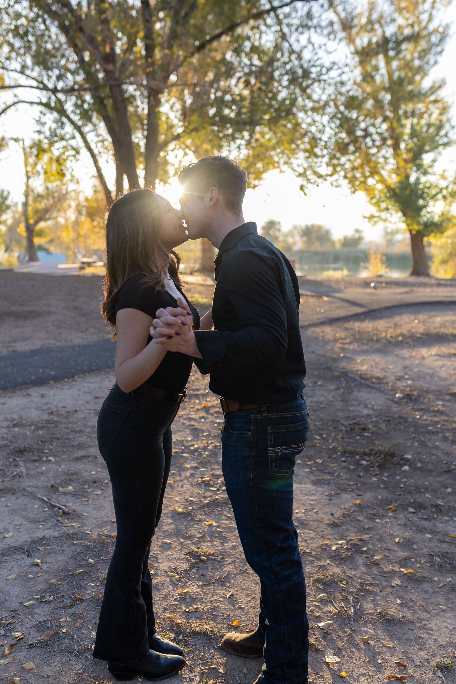 Young couple kissing in the sunset in Las Vegas by intimate elopement and engagement photographer
