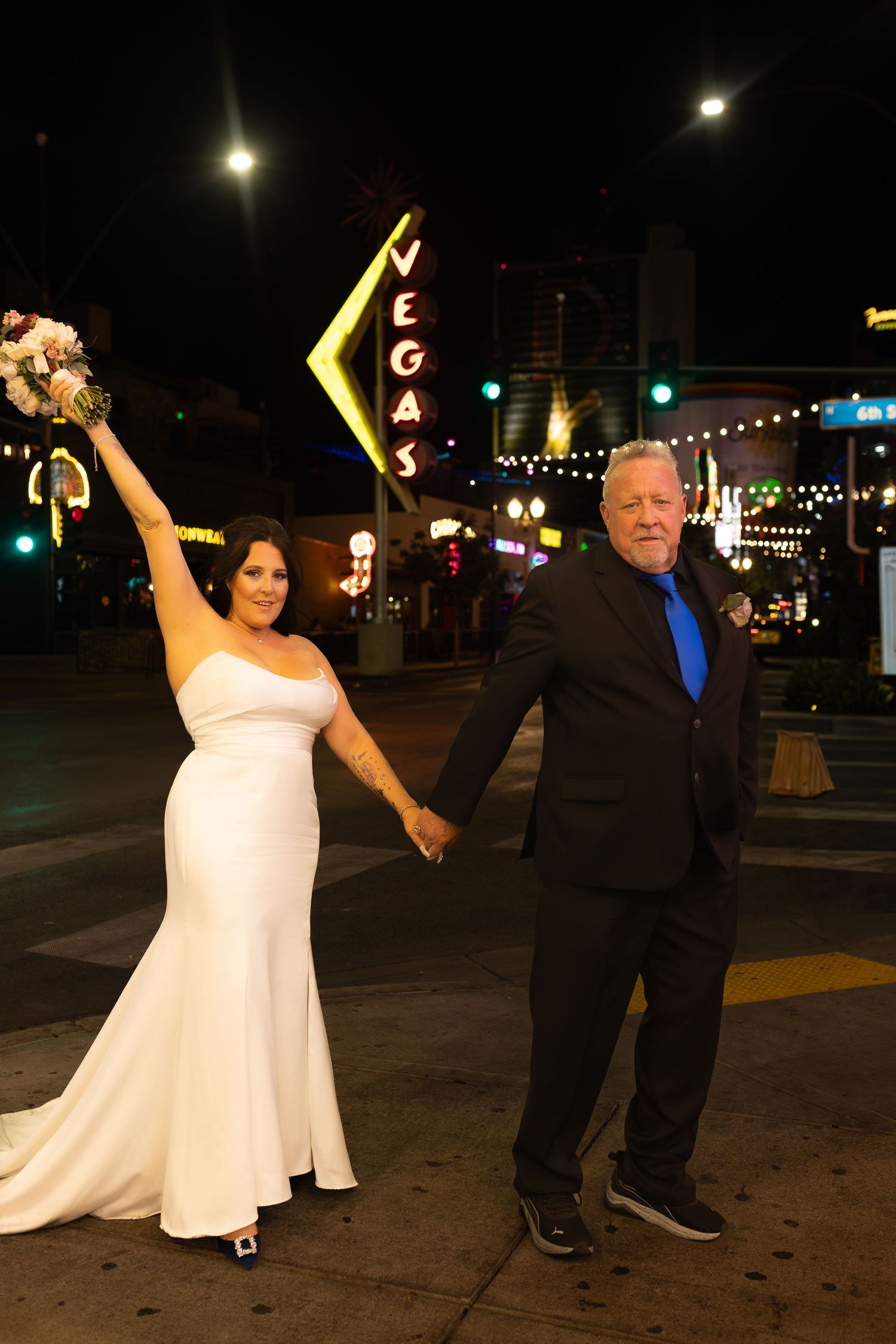 Couples eloping under neon lights on Fremont Street-Las Vegas photographer