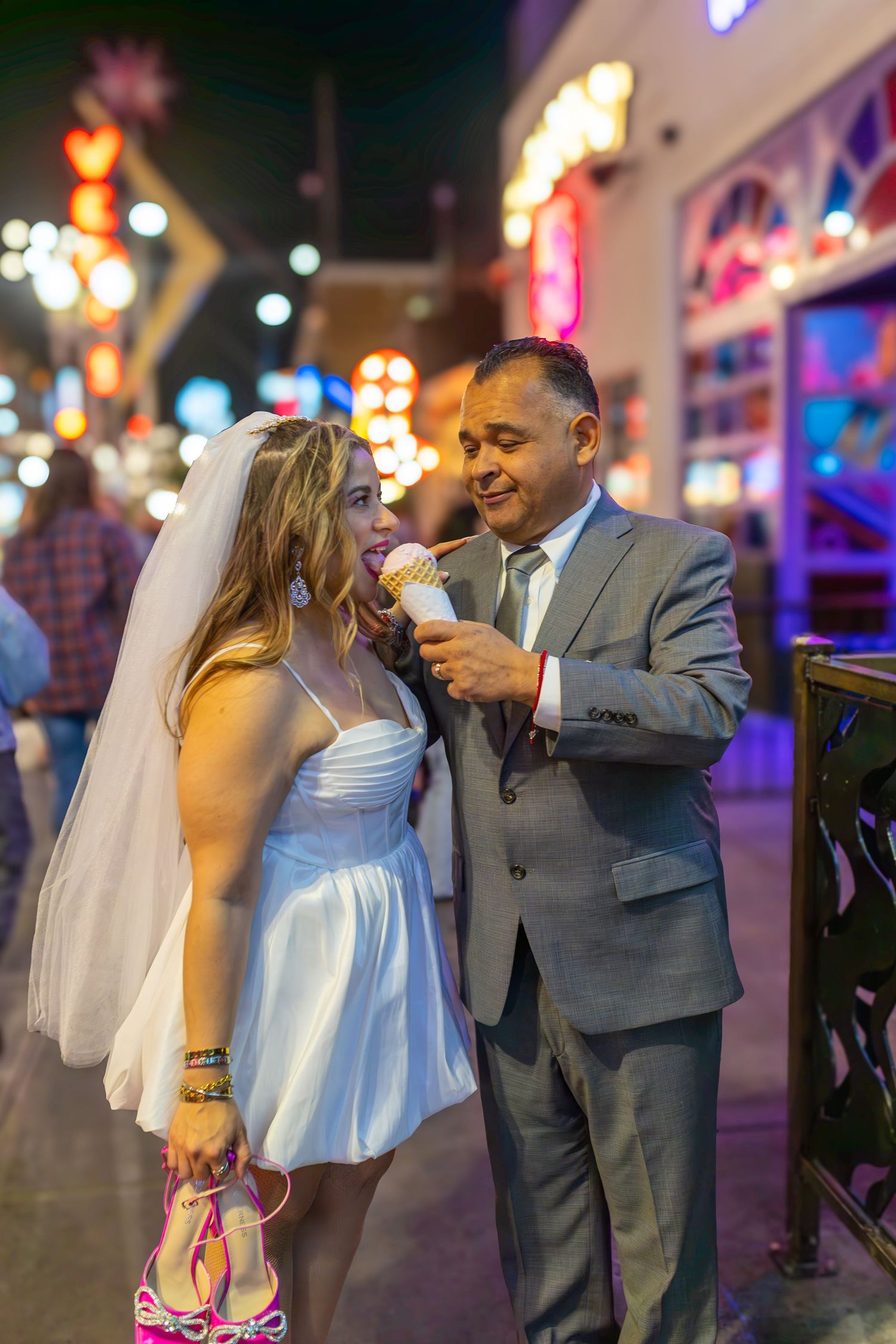 Couples eloping under neon lights on Fremont Street-Las Vegas photographer