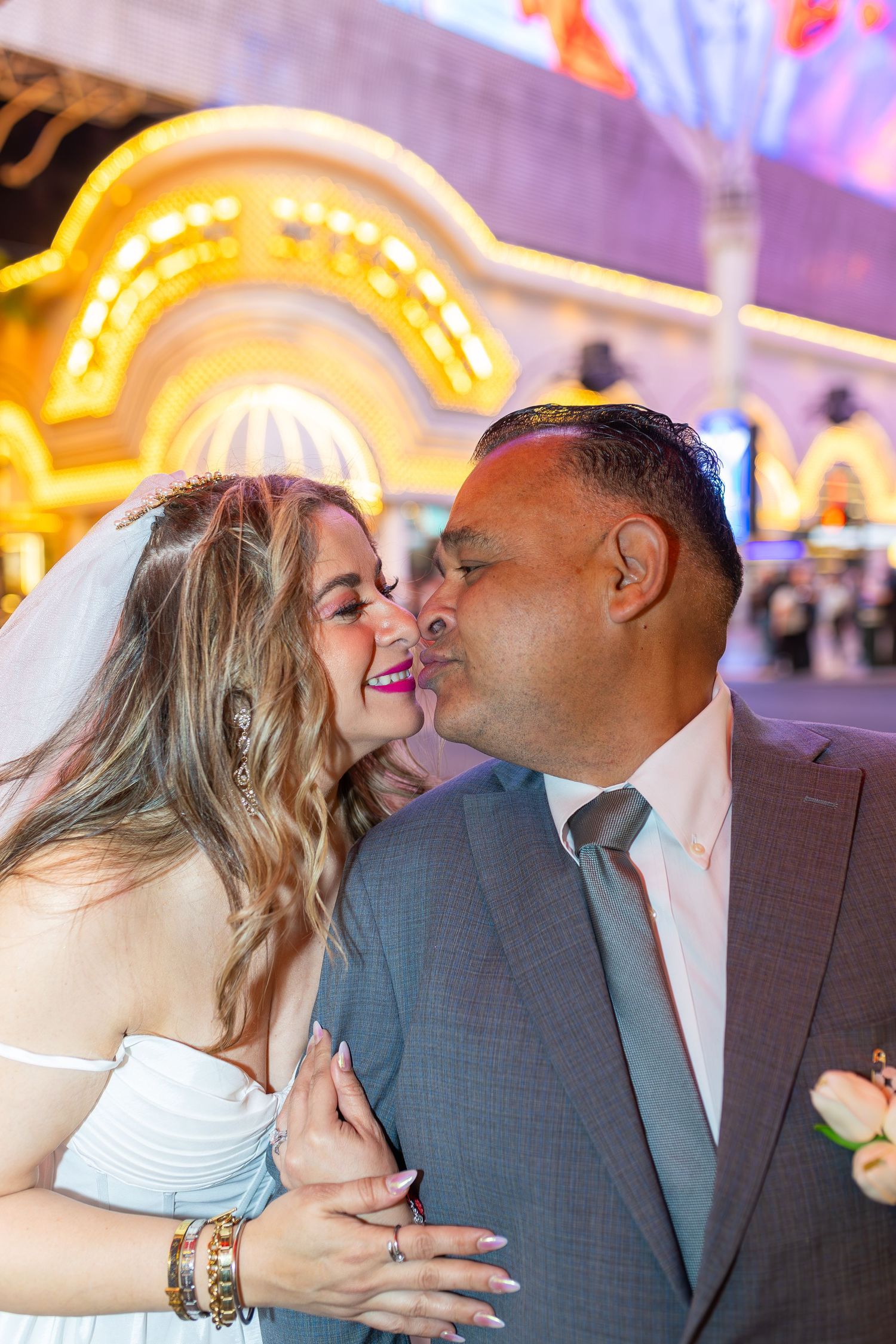 Couples eloping under neon lights on Fremont Street-Las Vegas photographer