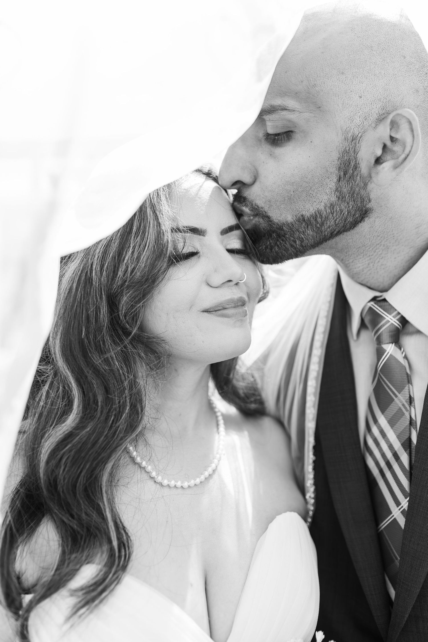 Bride and groom exchanging vows at the Little White chapel in downtown Las Vegas- intimate wedding and elopement photographer