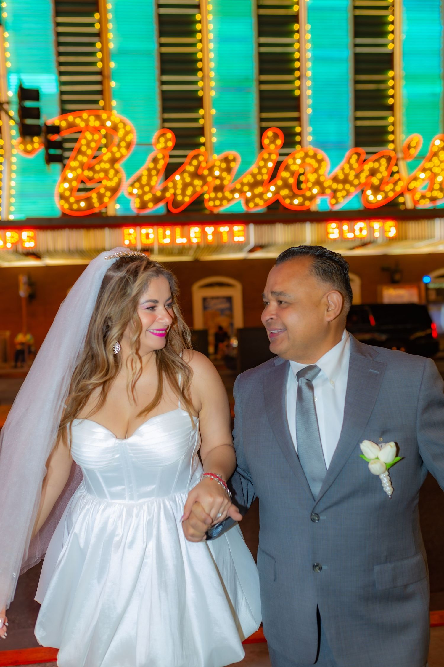 Couples eloping under neon lights on Fremont Street-Las Vegas photographer