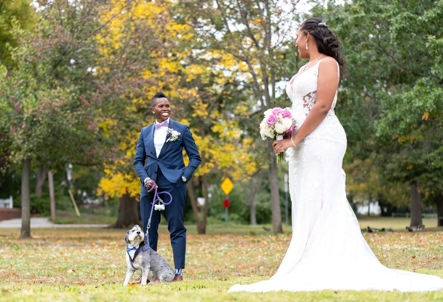 Romantic autumn wedding photos captured with golden fall foliage in background.