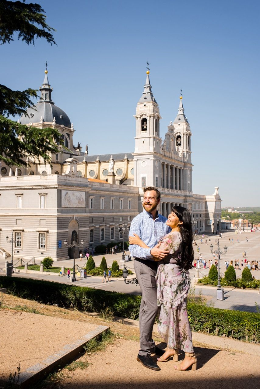 Cathedral of Madrid's stunning baroque architecture towering against a clear blue sky.