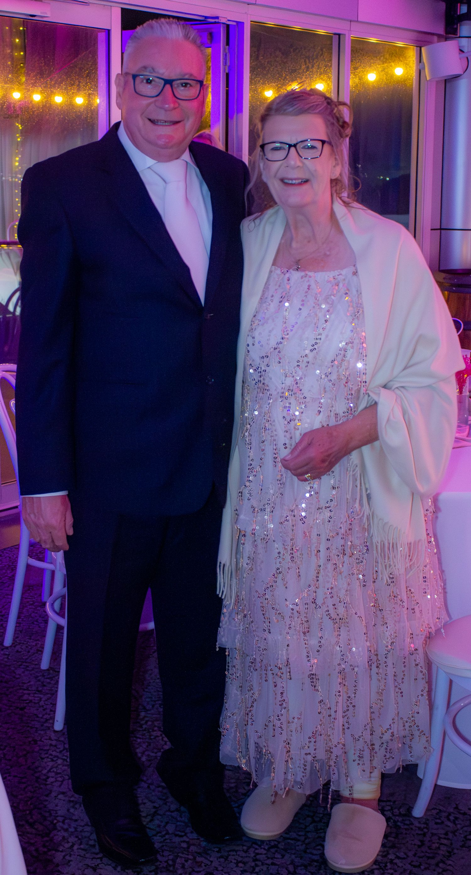 Portrait of mum and stepdad together during the wedding reception celebration.