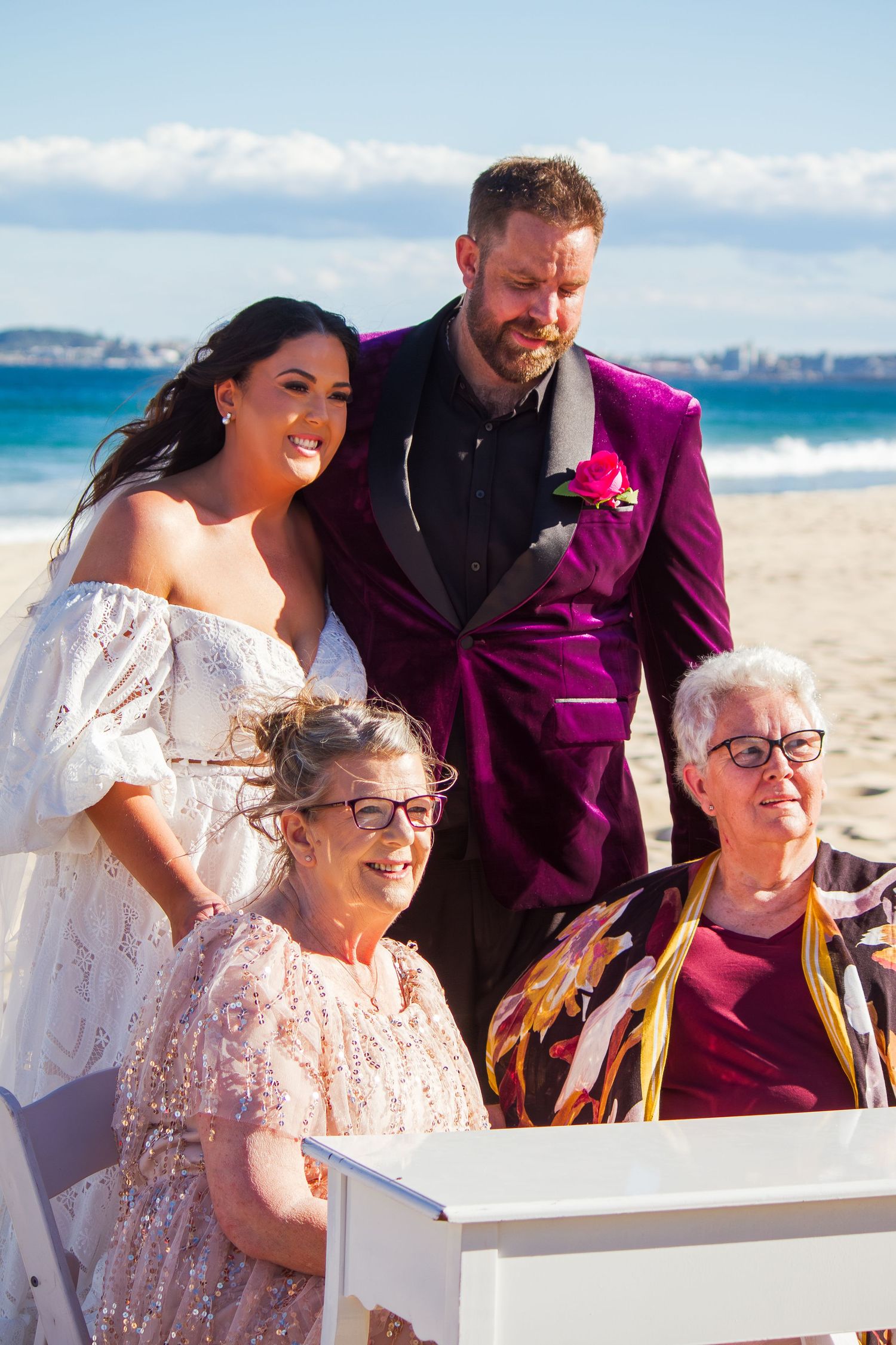 Portrait of the bride and groom with both mums after the ceremony, celebrating family and love shot during an Illawarra wedding.