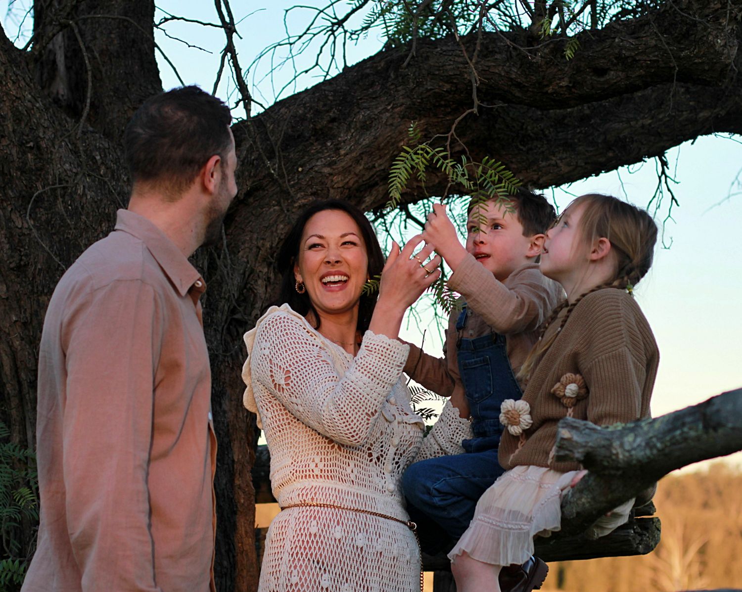 Candid portrait during a family session of family together in the countryside