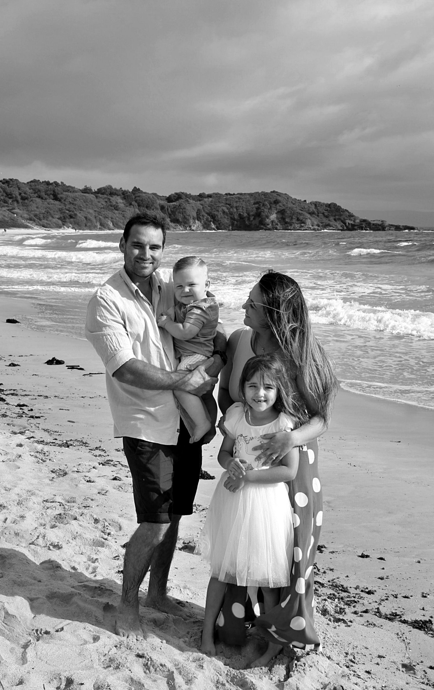 Family portraits by the sea in the Illawarra, documenting genuine moments and timeless beachside connection.
