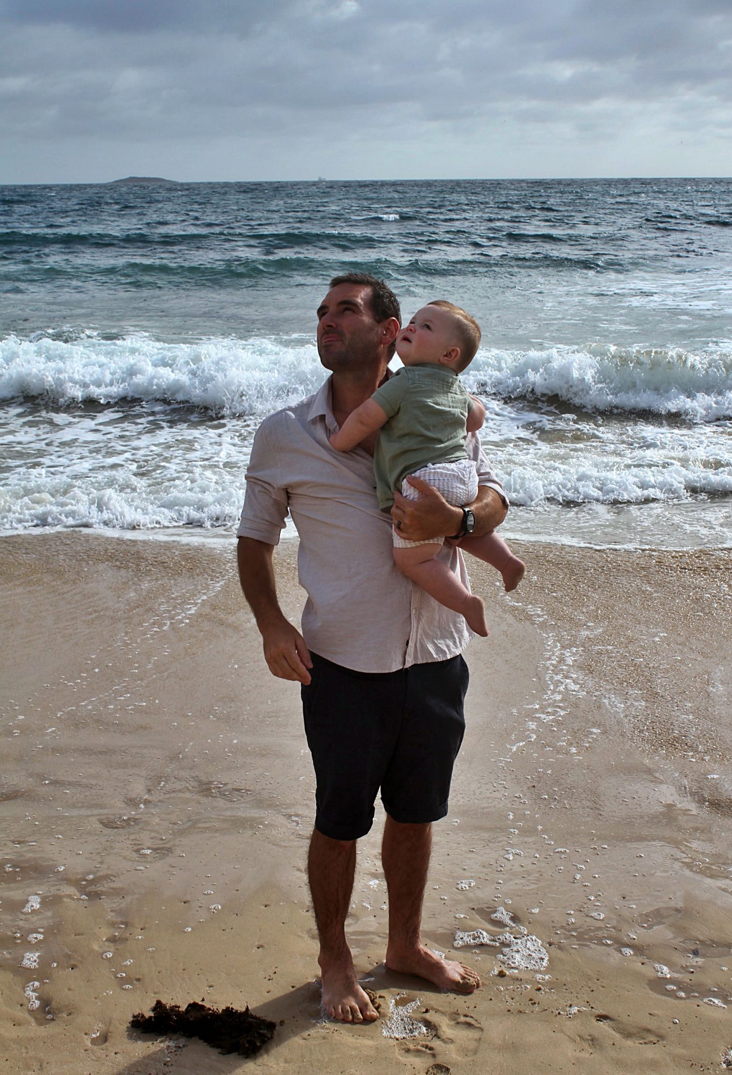 Dad and son portraits on the beach in the Illawarra, capturing loving connection and natural coastal moments.