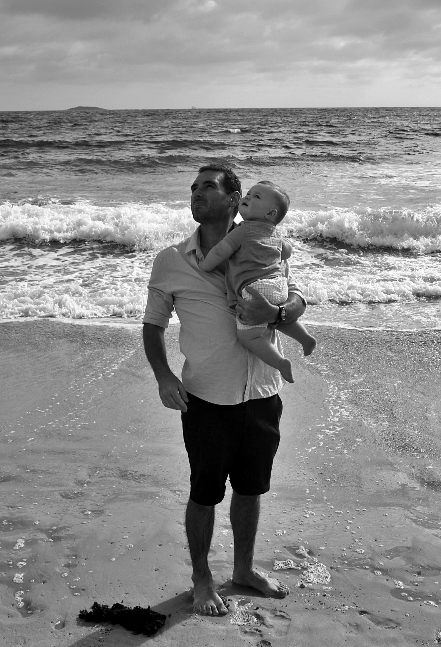 Dad and son portraits on the beach in the Illawarra, capturing loving connection and natural coastal moments.