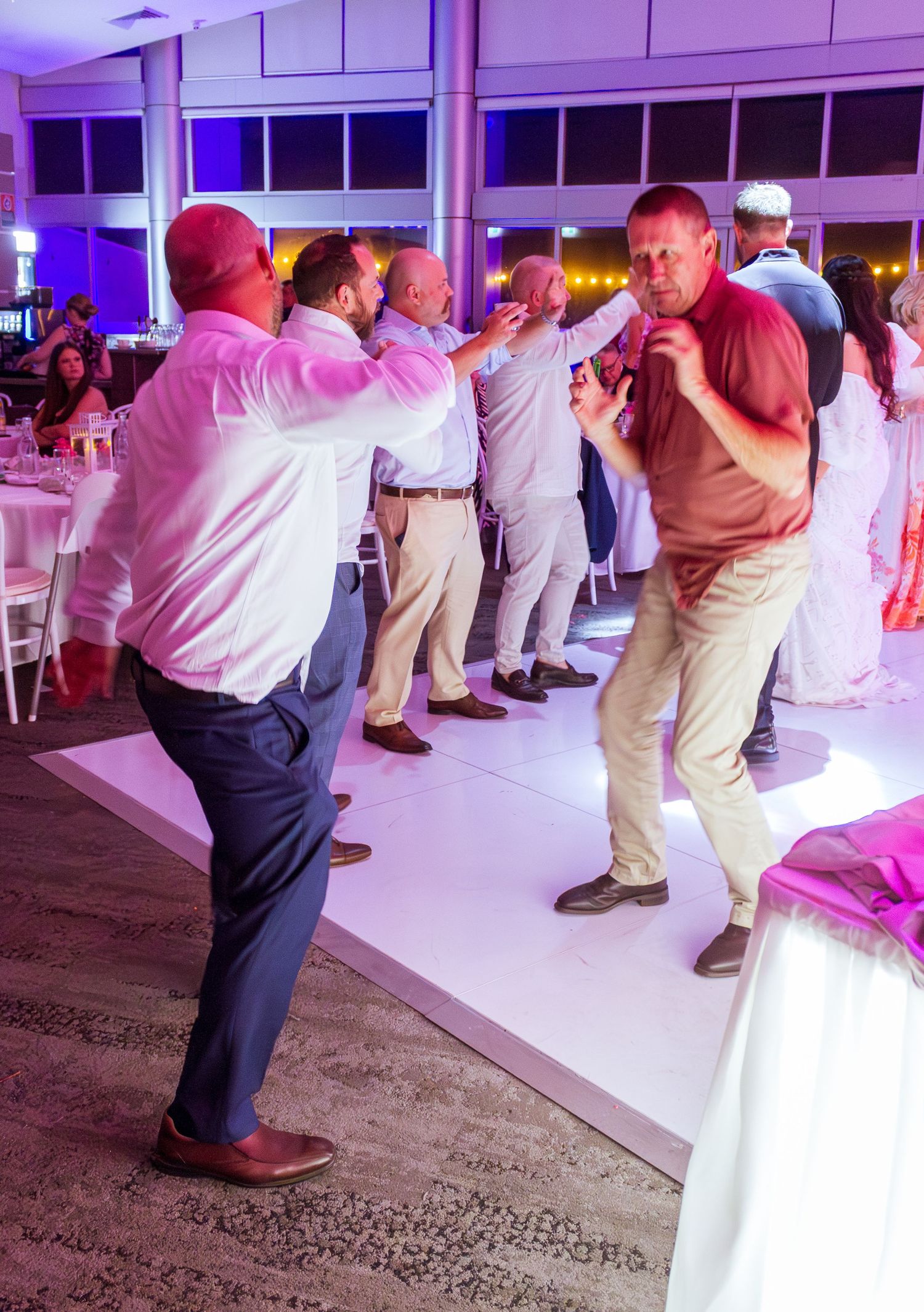 Guests celebrating on the dance floor at the wedding reception, fun party moments with friends and family taken in the Illawarra.