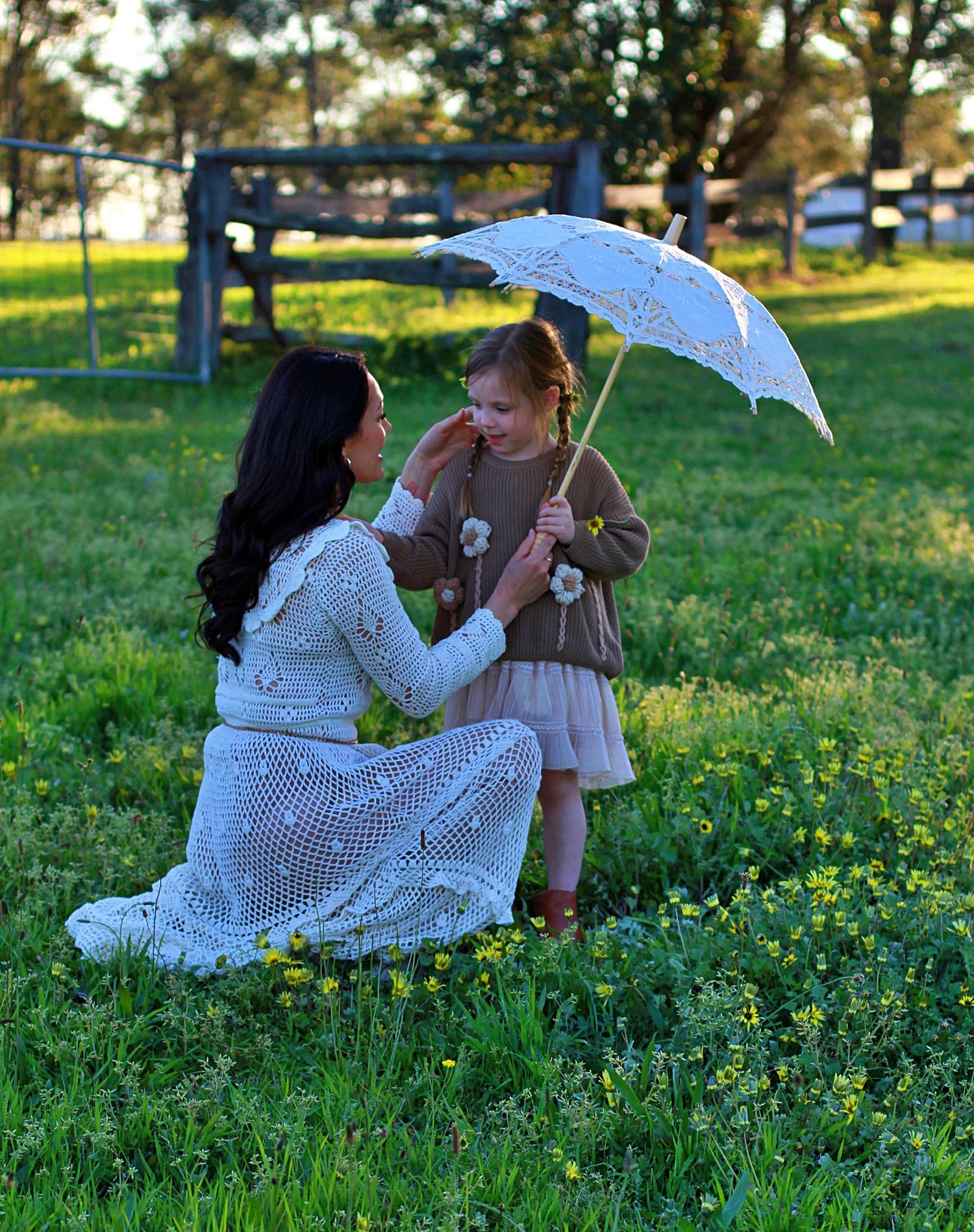 Mum and daughter sharing a quiet moment in nature during a family session