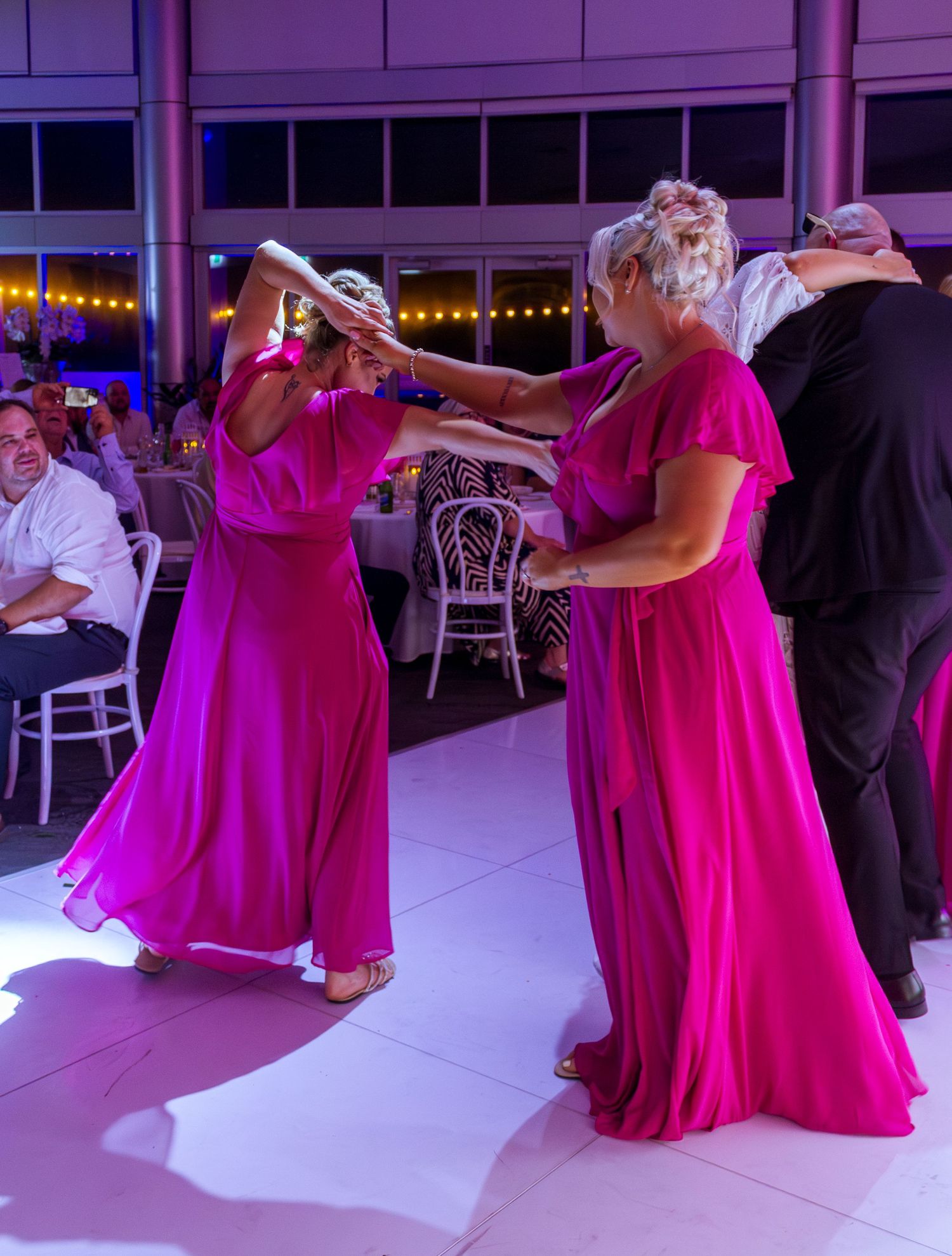 Guests celebrating on the dance floor at the wedding reception, fun party moments with friends and family taken in the Illawarra.