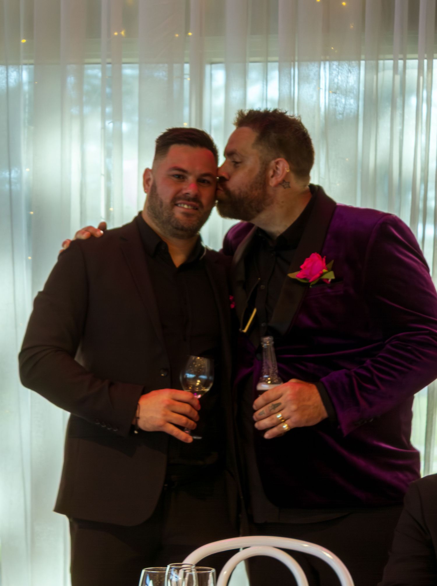 Groom and groomsmen having fun during wedding portraits.
