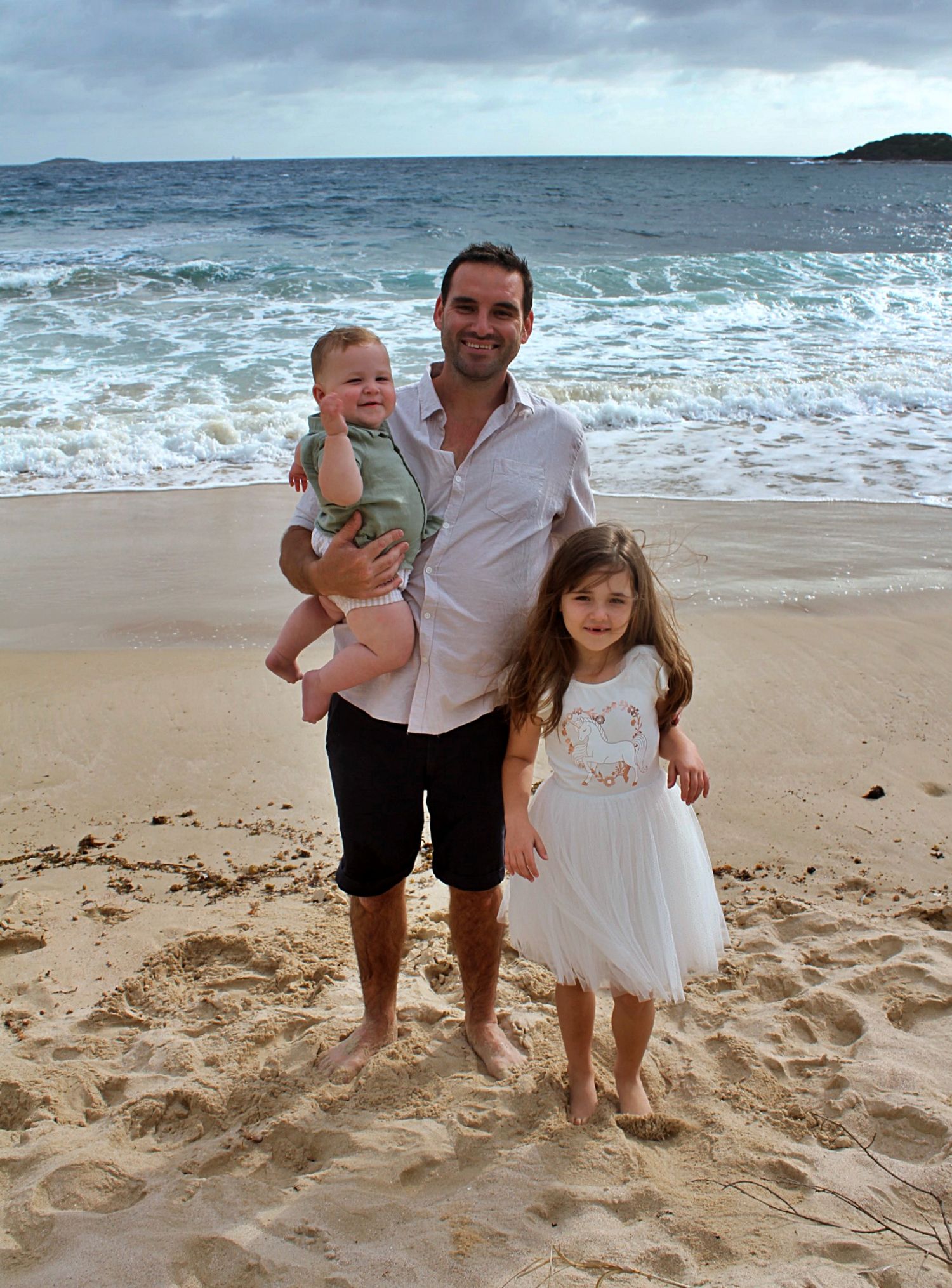 Natural beach portraits of dad with his daughter and son in the Illawarra.