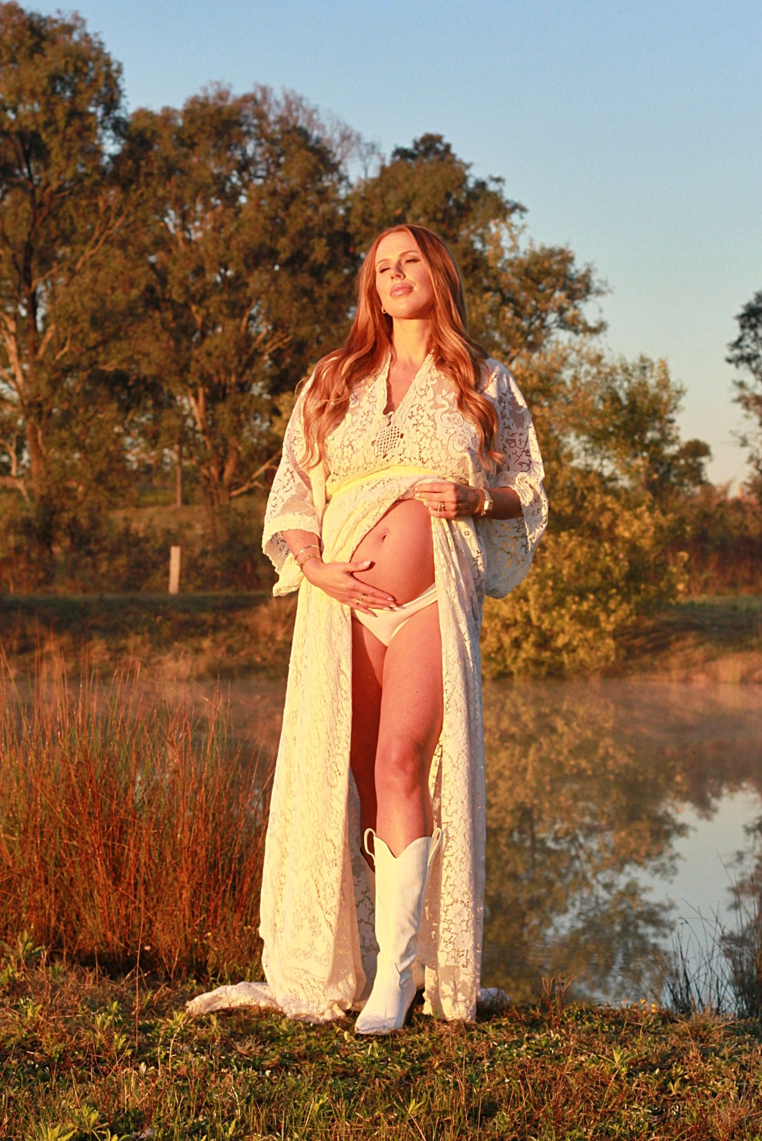 Mumma-to-be enjoying a peaceful sunrise maternity shoot.