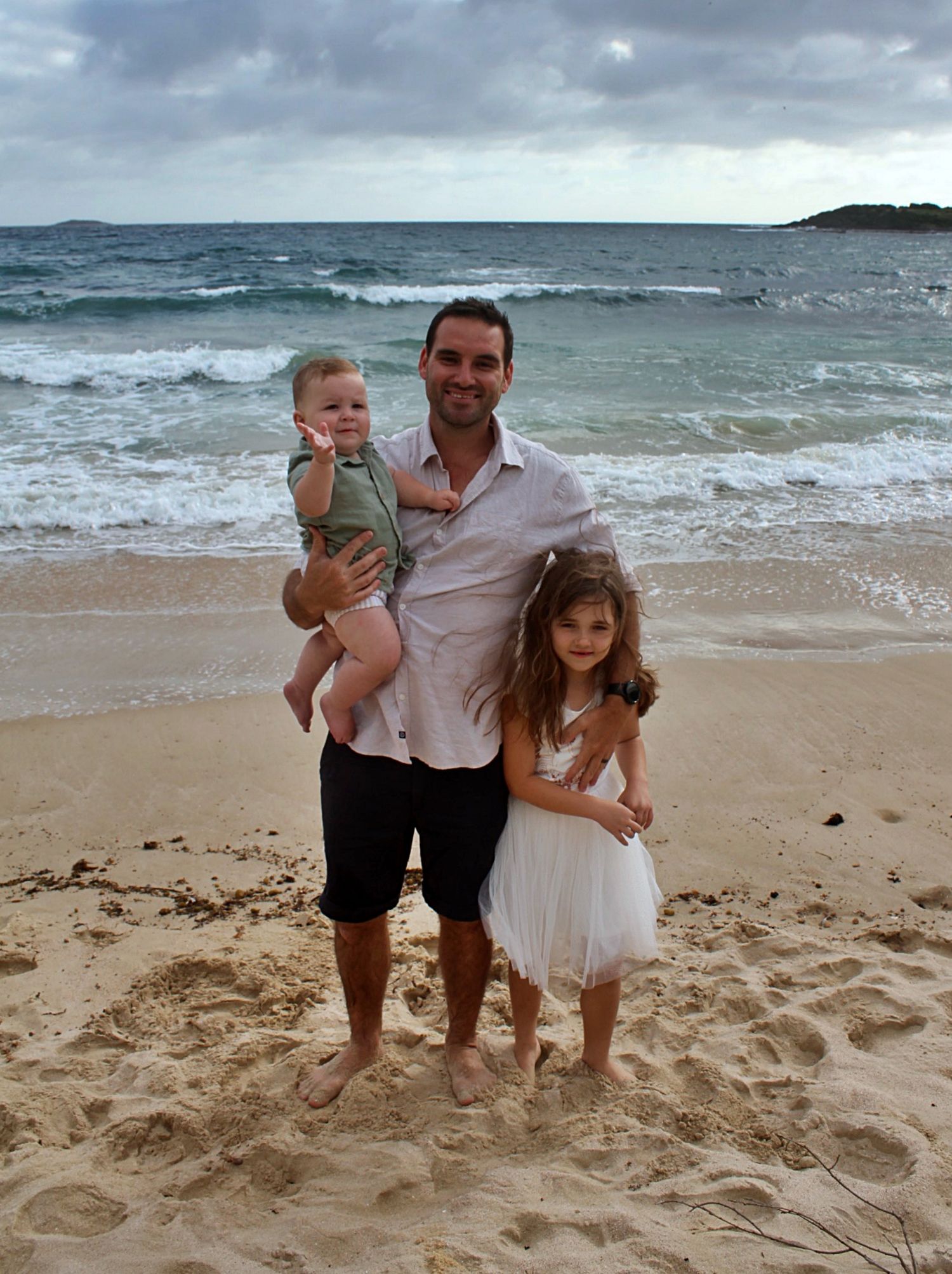 Natural beach portraits of dad with his daughter and son in the Illawarra.