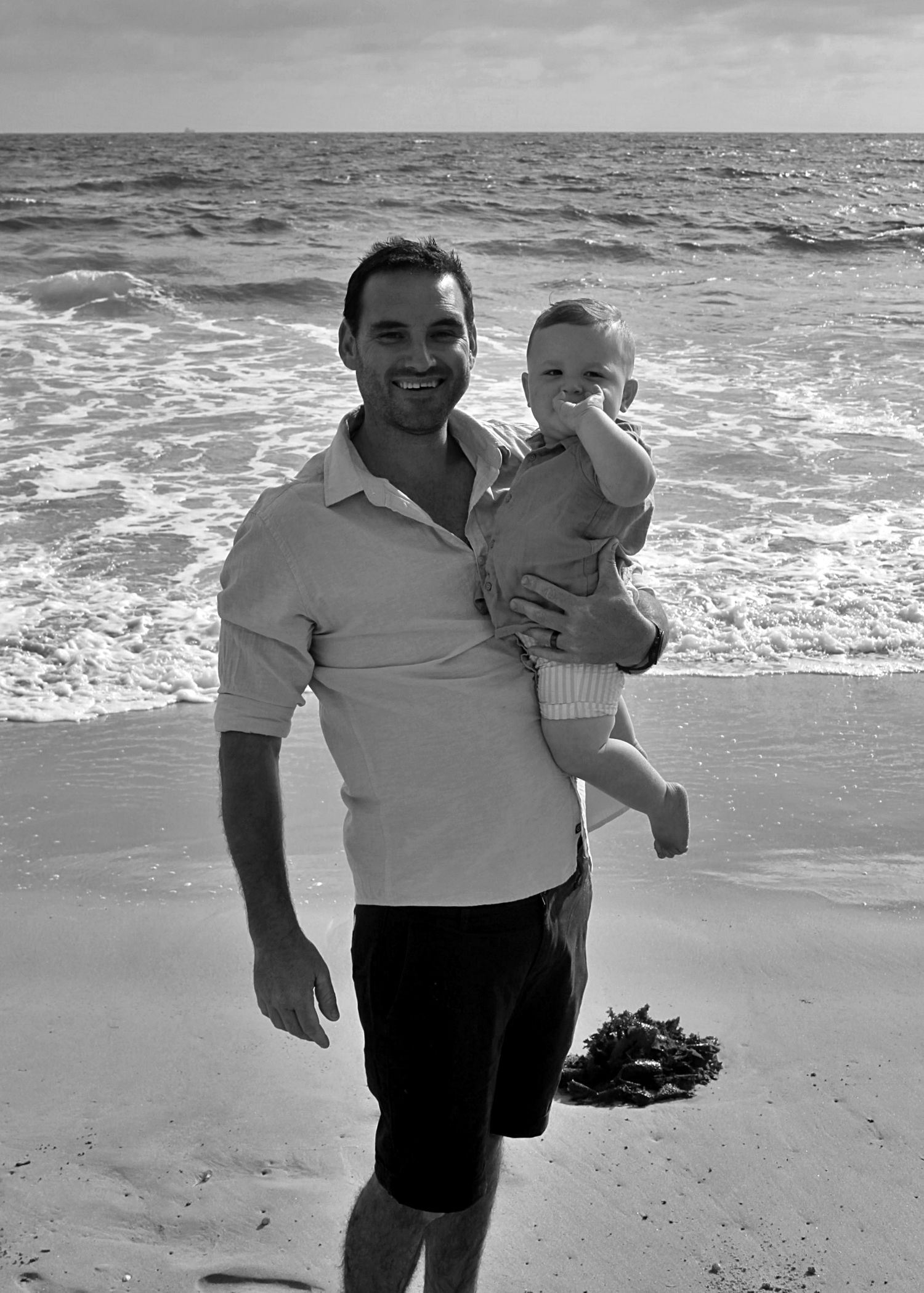Dad and son portraits on the beach in the Illawarra, capturing loving connection and natural coastal moments.