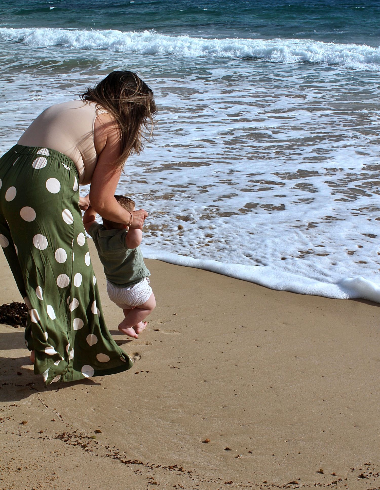 Candid mum and son portraits on the beach in the Illawarra, capturing tenderness and natural family connection
