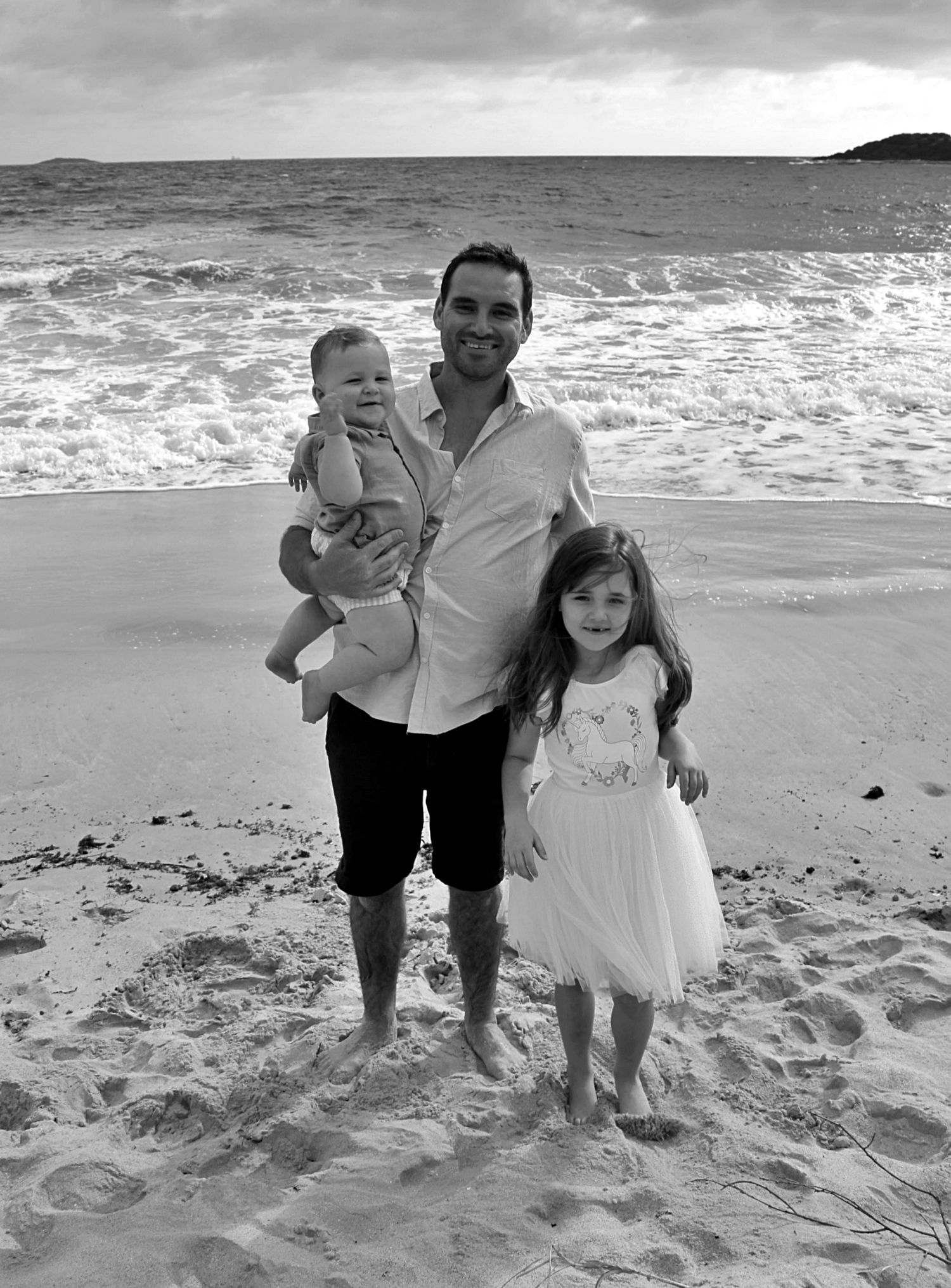 Natural beach portraits of dad with his daughter and son in the Illawarra.
