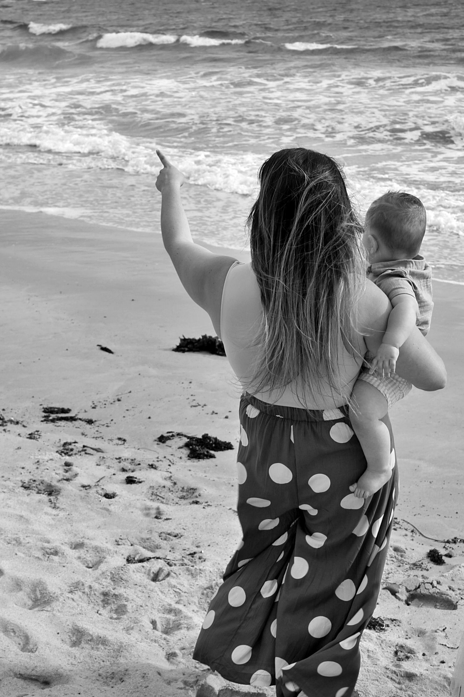 Candid mum and son portraits on the beach in the Illawarra, capturing tenderness and natural family connection