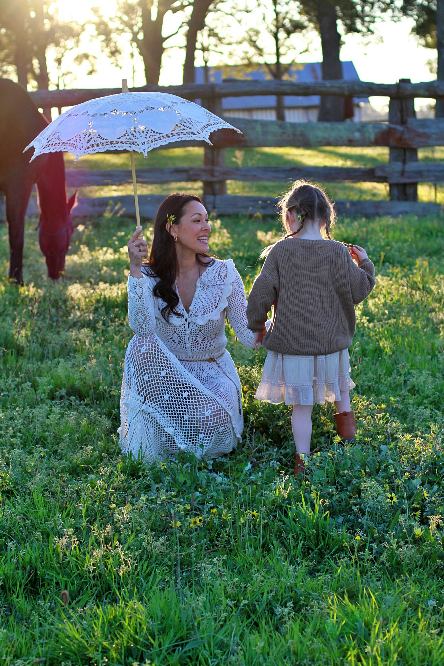 Mum and daughter sharing a quiet moment in nature during a family session