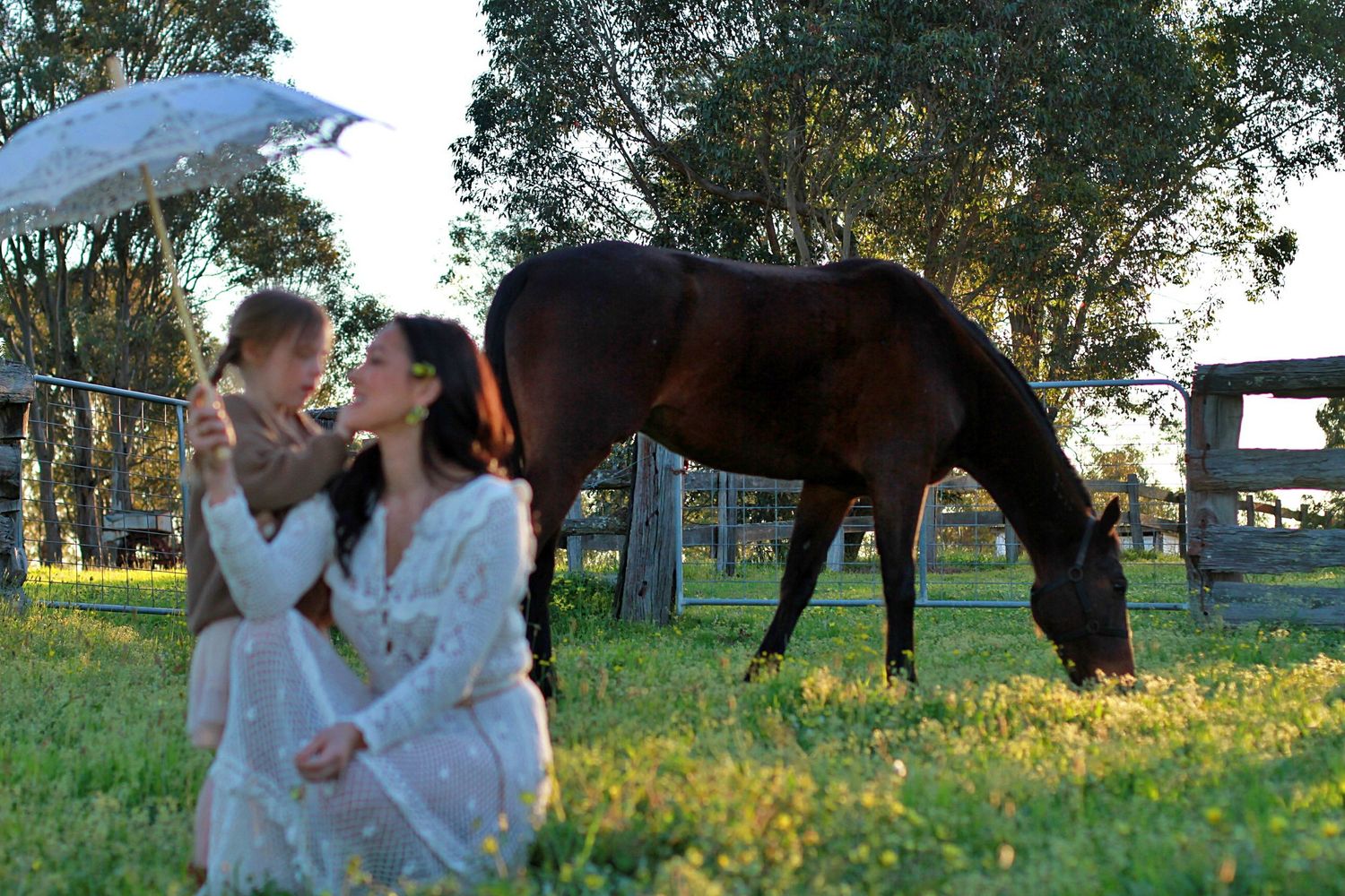Mum and daughter sharing a quiet moment in nature during a family session