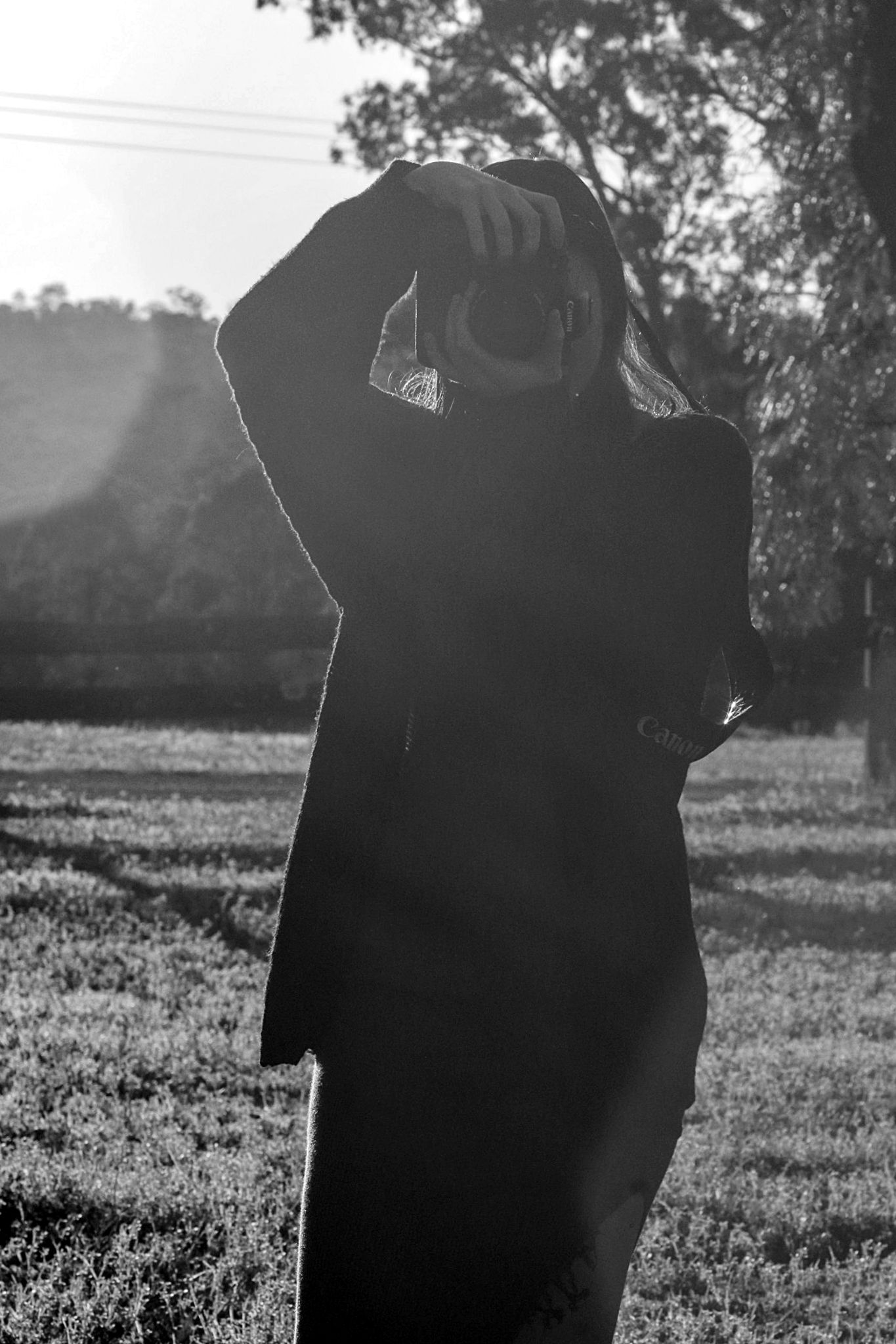 A Lasting Impression photographer holding a camera and taking a photo, capturing a moment during a professional photoshoot