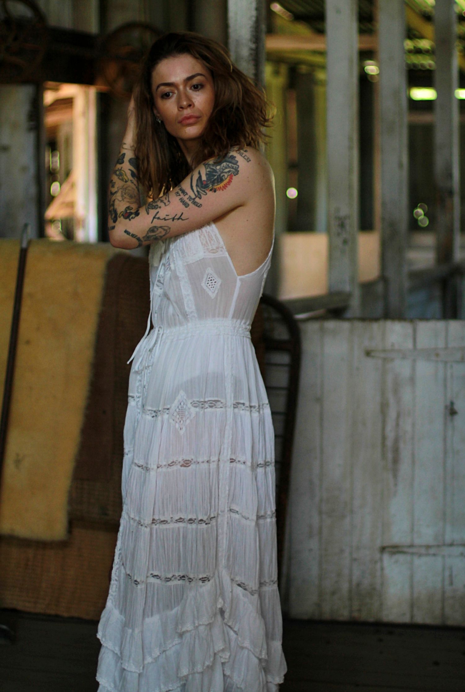 Elegant solo engagement photos of a woman at a countryside barn