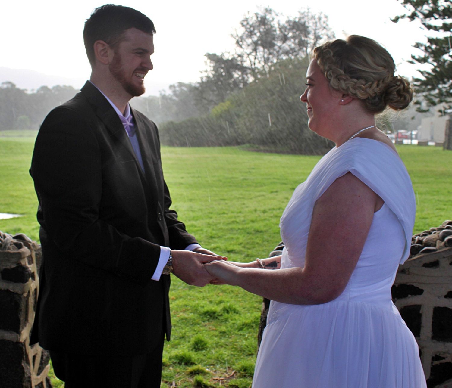 Bride and groom holding hands during ceremony during micro wedding in the Illawarra