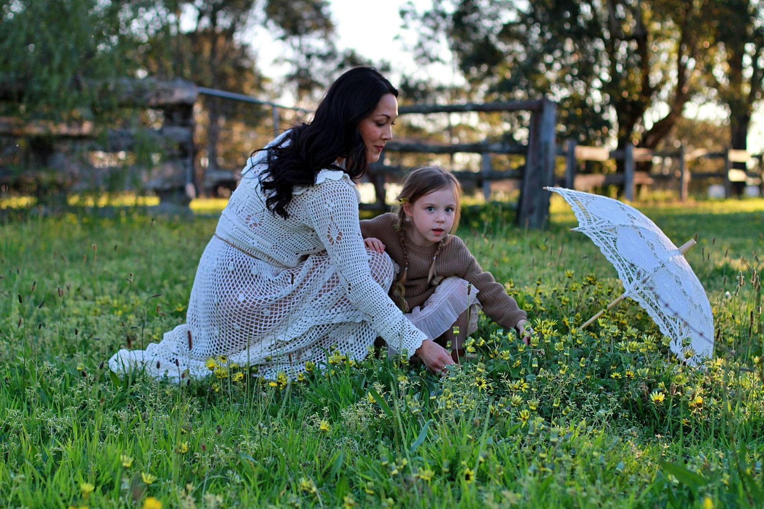 Mum and daughter sharing a quiet moment in nature during a family session