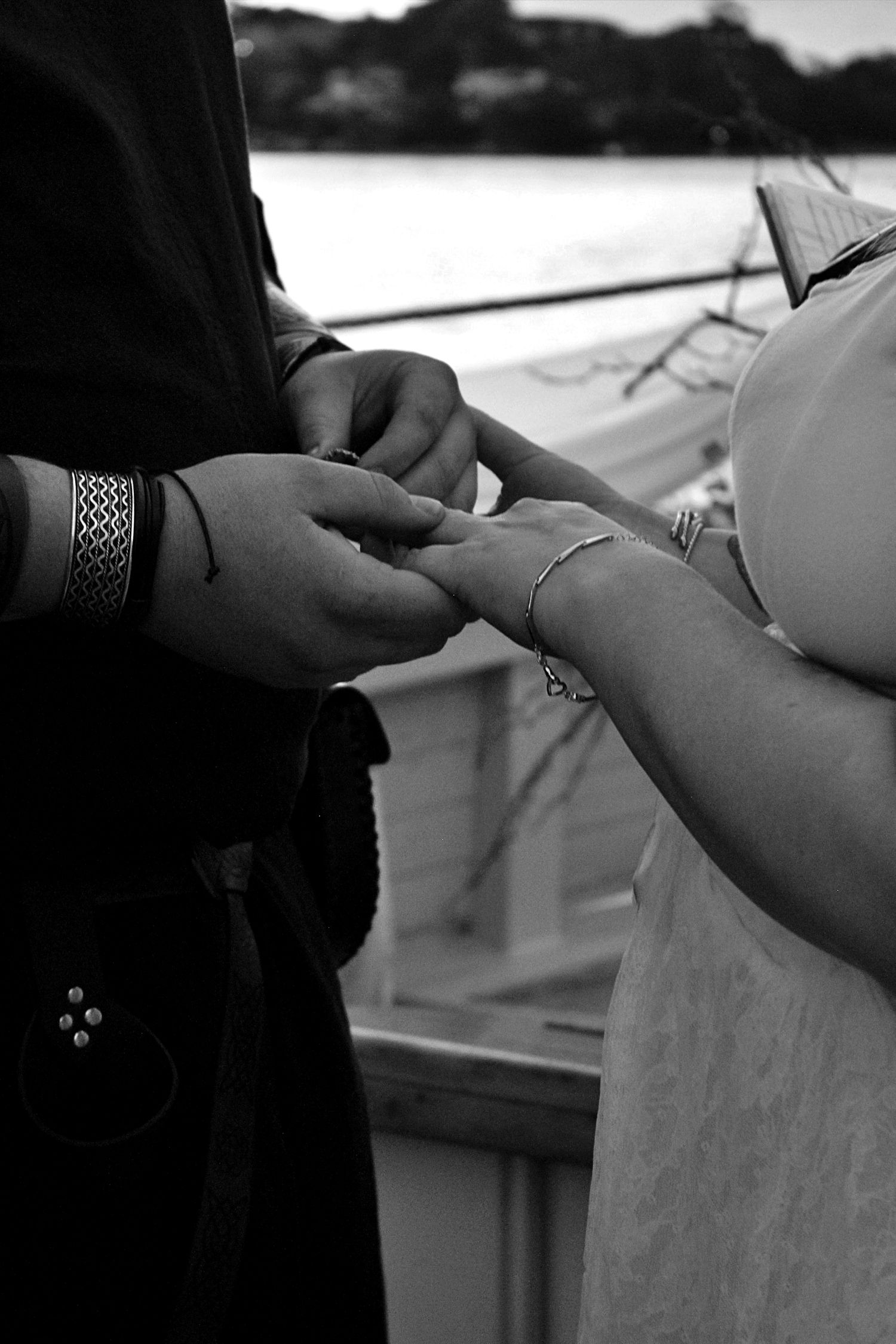 Wedding ring exchange aboard a pirate ship in Sydney, capturing an intimate and unconventional ceremony moment.