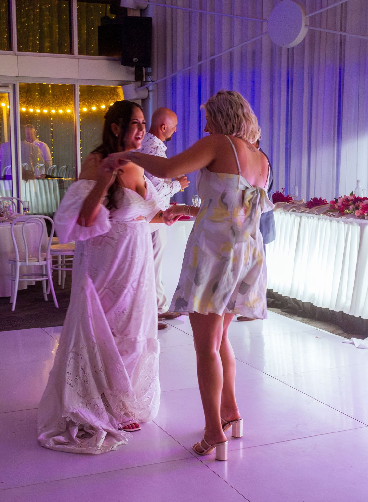 Guests celebrating on the dance floor at the wedding reception, fun party moments with friends and family taken in the Illawarra.