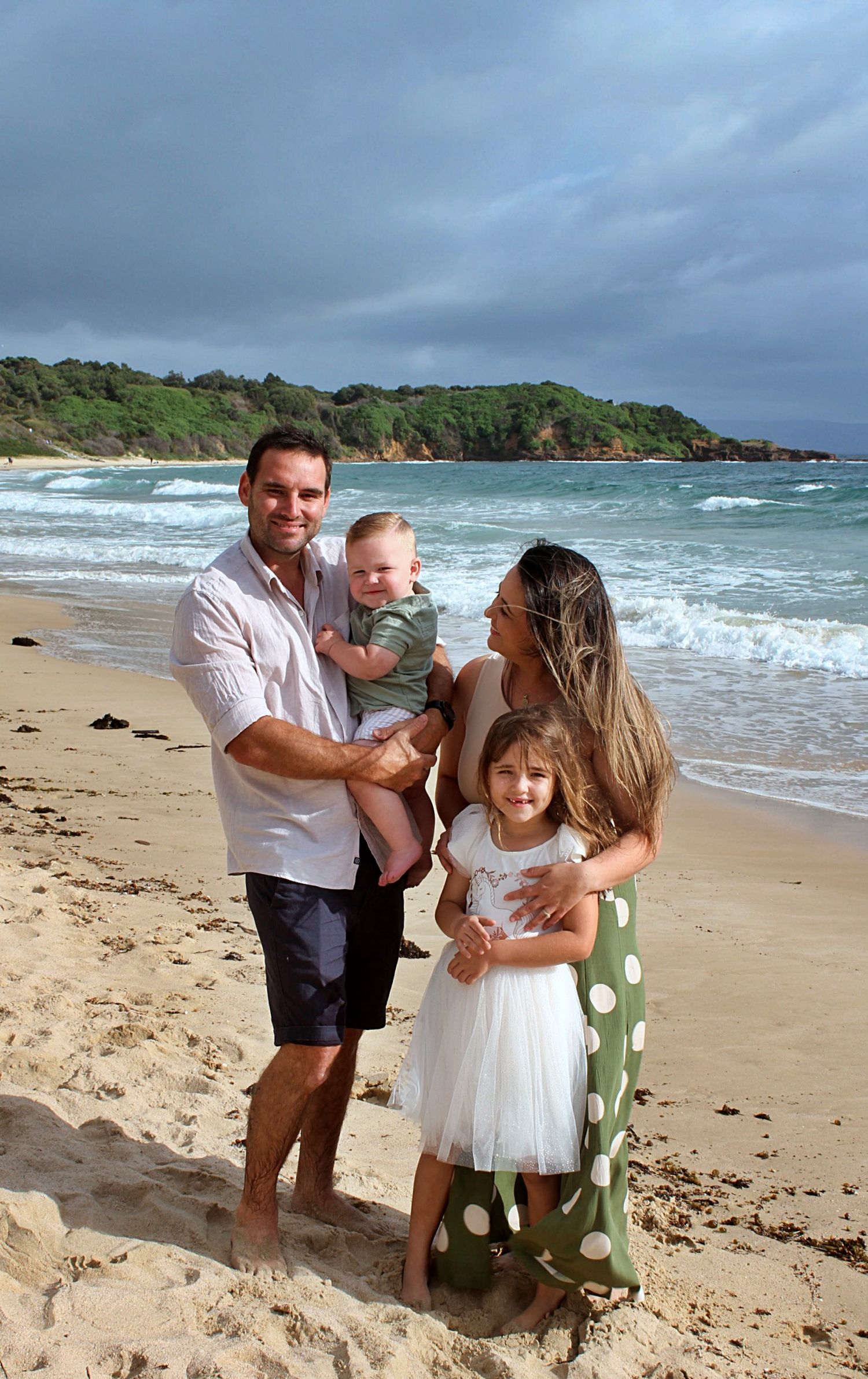 Family portraits by the sea in the Illawarra, documenting genuine moments and timeless beachside connection.