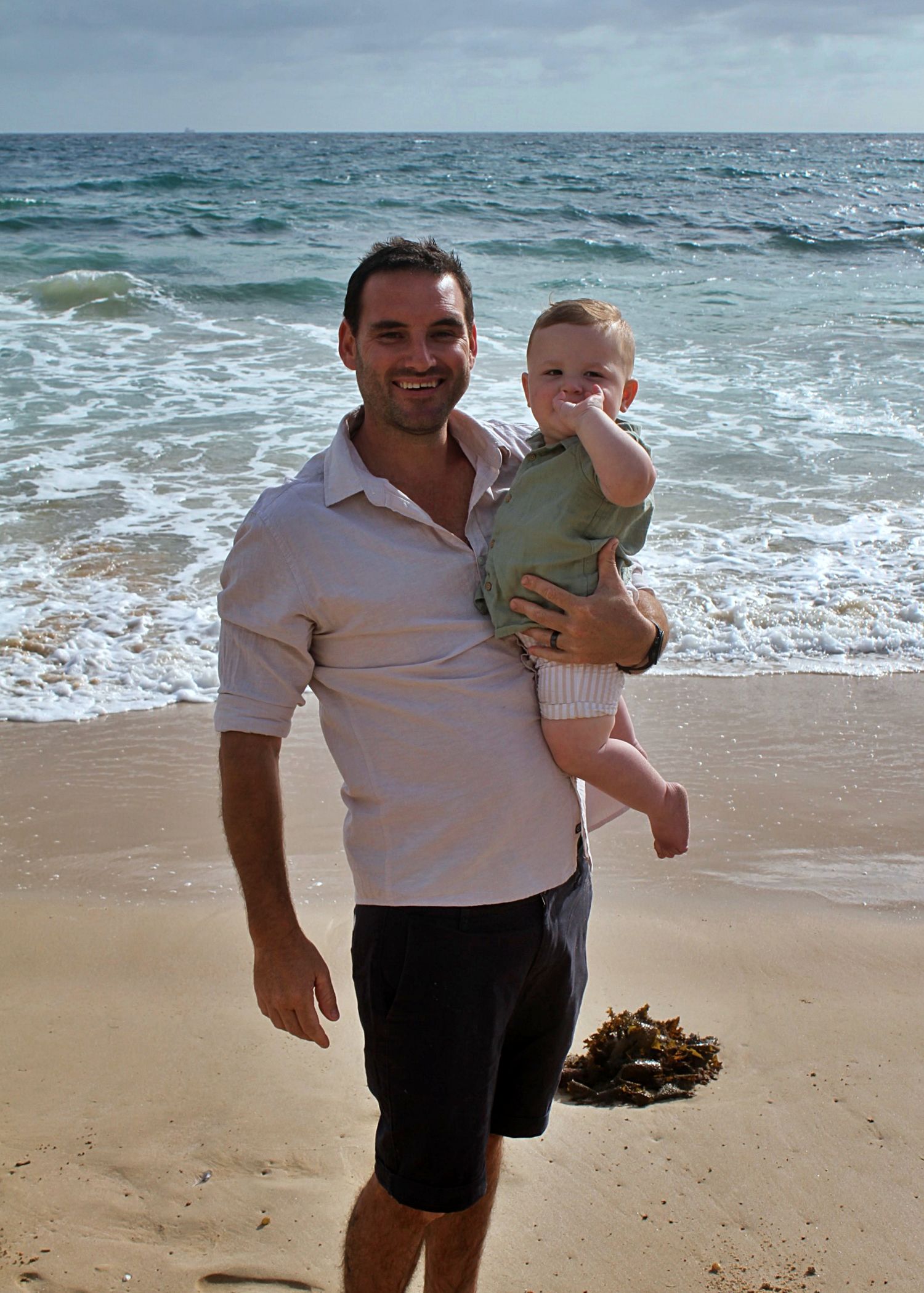 Dad and son portraits on the beach in the Illawarra, capturing loving connection and natural coastal moments.