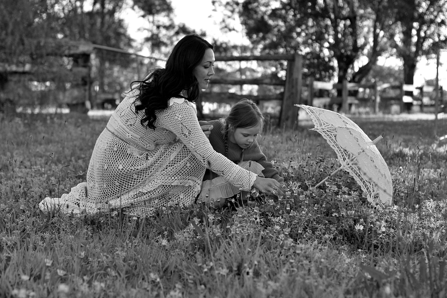 Mum and daughter sharing a quiet moment in nature during a family session