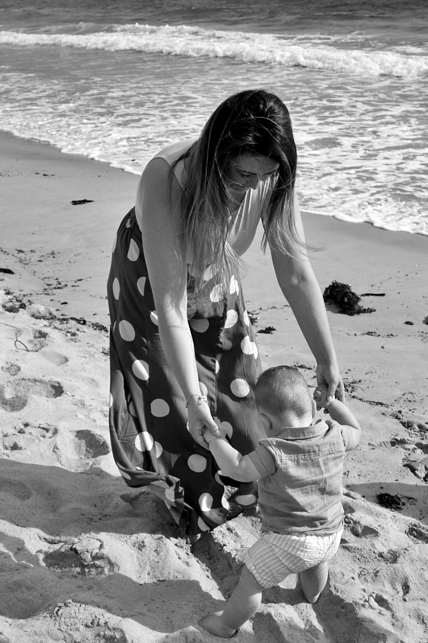 Candid mum and son portraits on the beach in the Illawarra, capturing tenderness and natural family connection