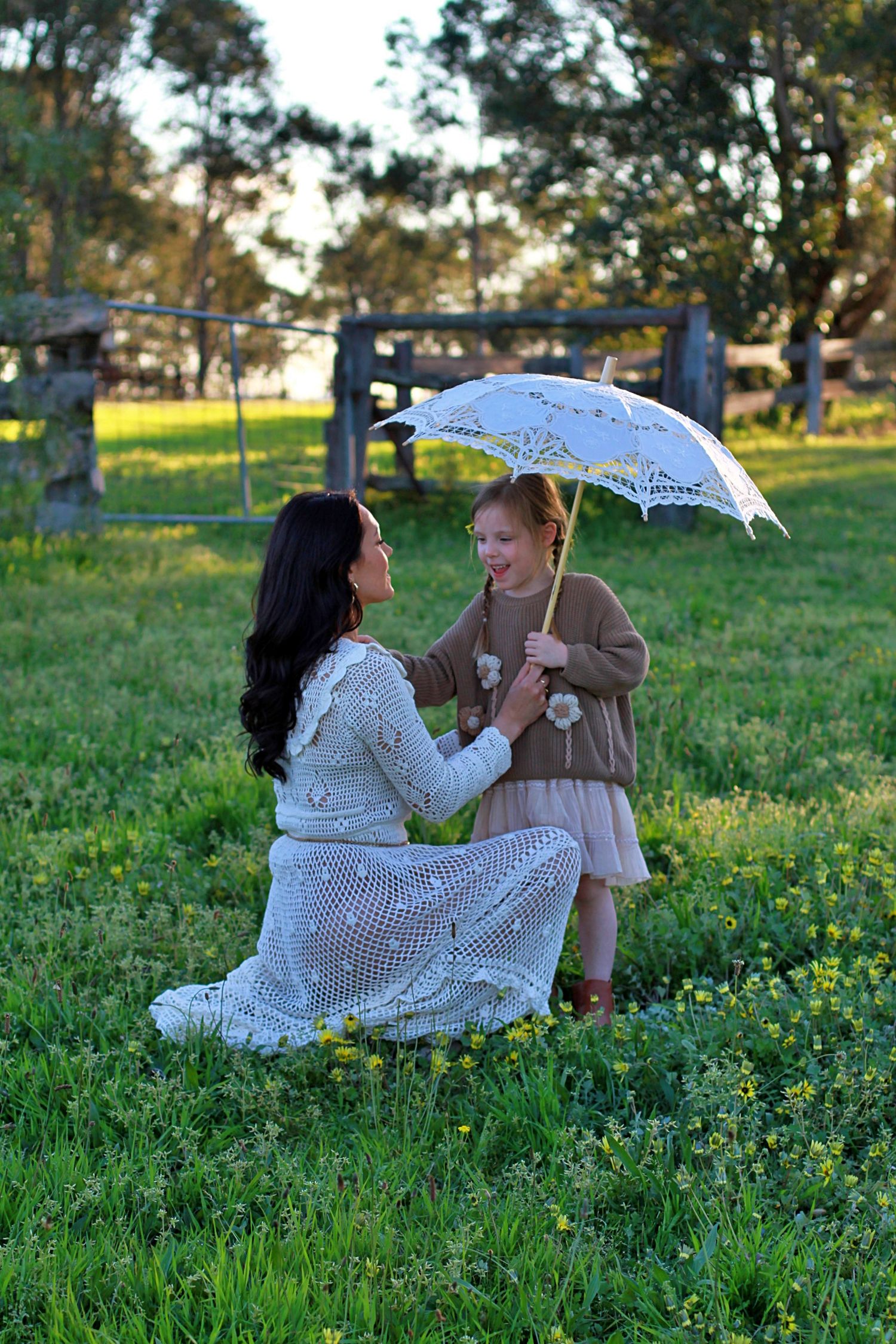 Mum and daughter sharing a quiet moment in nature during a family session