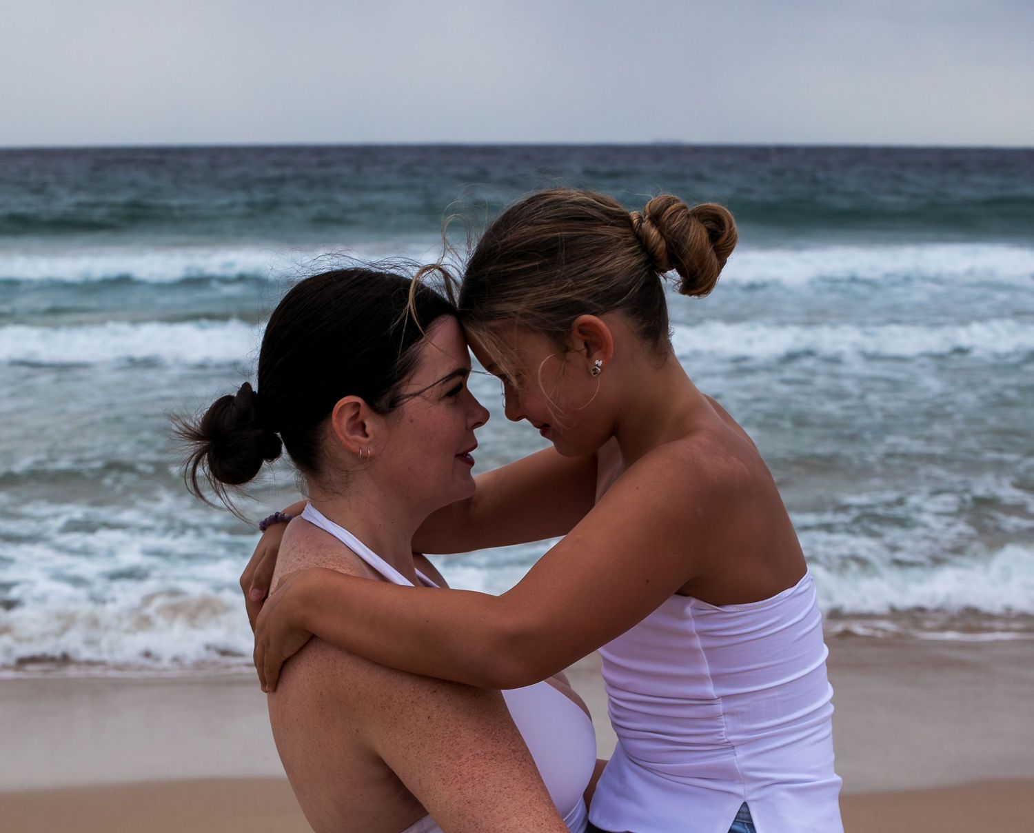 Loving motherhood portrait, mother and daughter sharing a gentle moment by A Lasting Impression Photography.