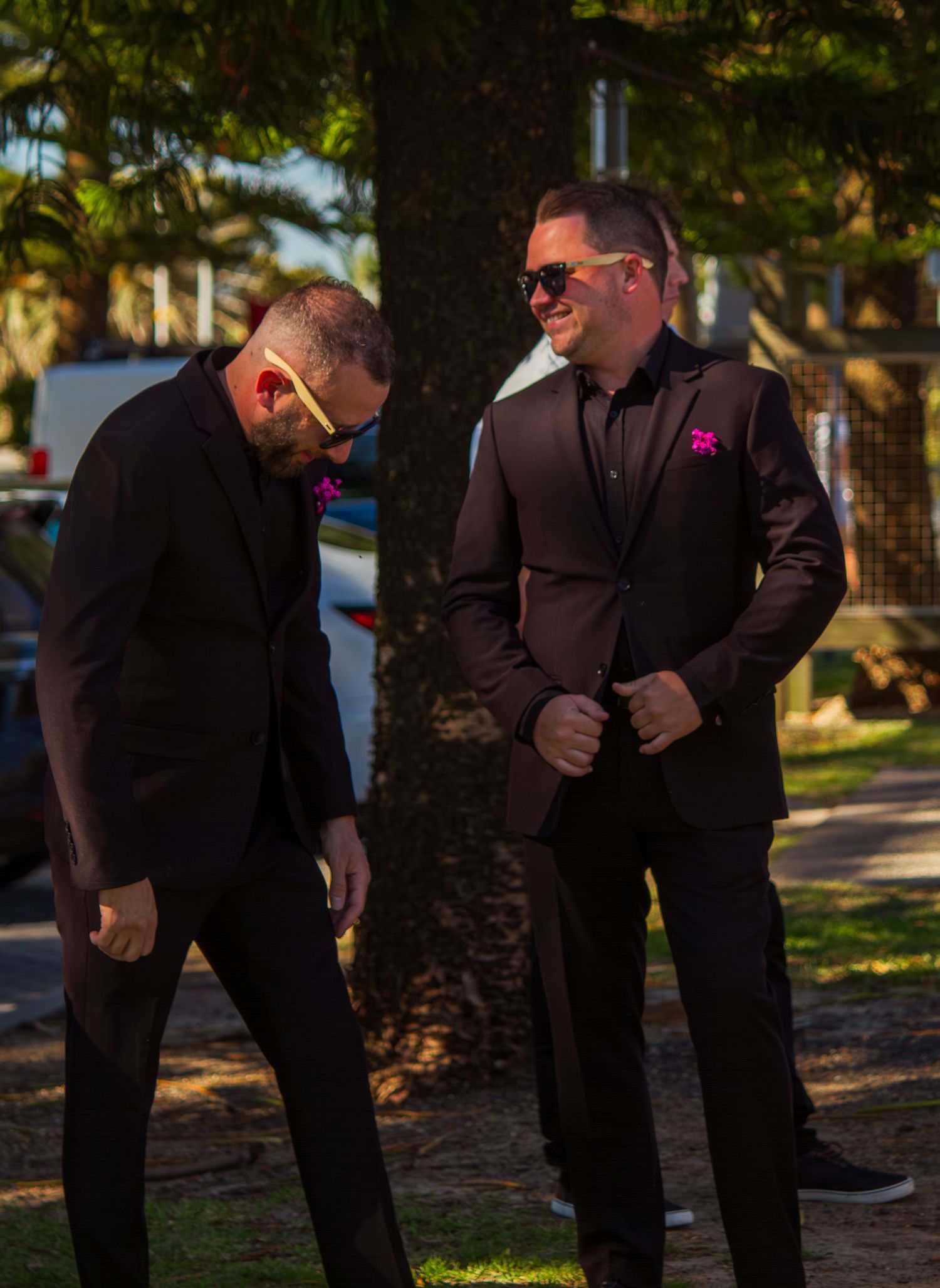 Groomsmen chatting together before the beach wedding ceremony, relaxed moments in the Illawarra.
