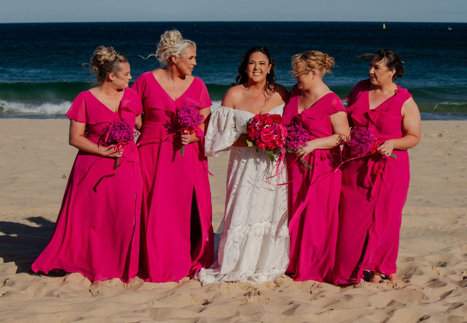 Bride portrait with her bridesmaids, celebrating friendship and the wedding day.