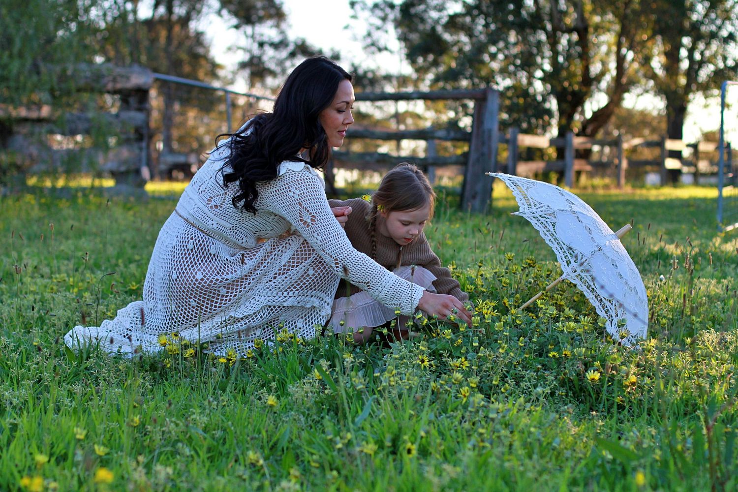 Mum and daughter sharing a quiet moment in nature during a family session