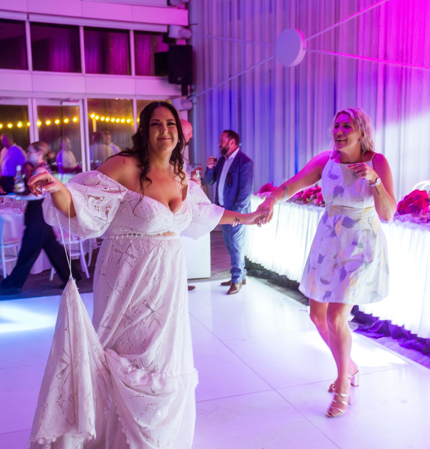 Guests celebrating on the dance floor at the wedding reception, fun party moments with friends and family taken in the Illawarra.