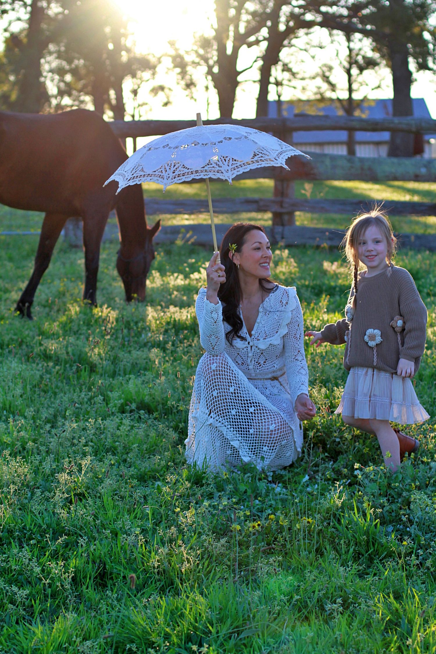 Mum and daughter sharing a quiet moment in nature during a family session