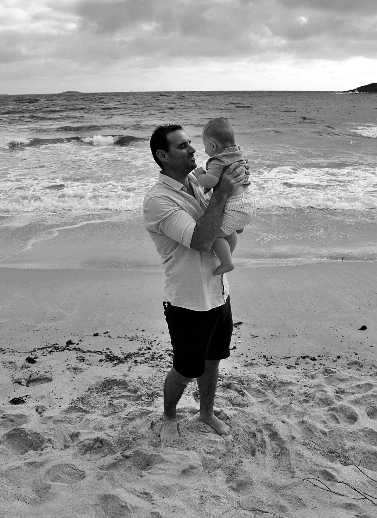Dad and son portraits on the beach in the Illawarra, capturing loving connection and natural coastal moments.
