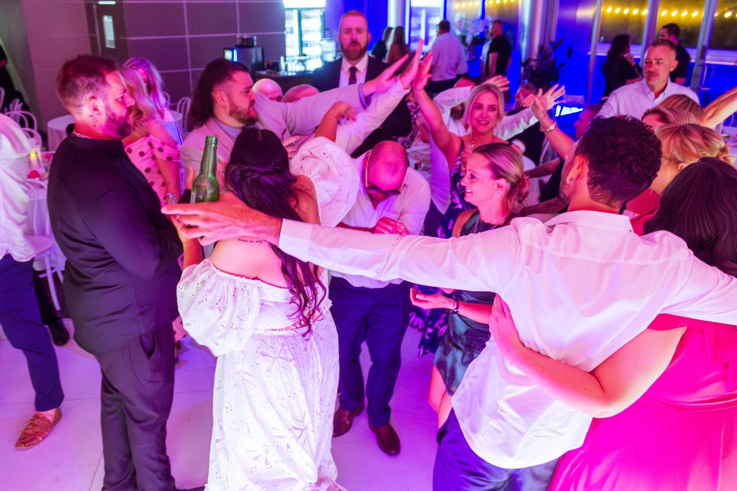Guests celebrating on the dance floor at the wedding reception, fun party moments with friends and family taken in the Illawarra.