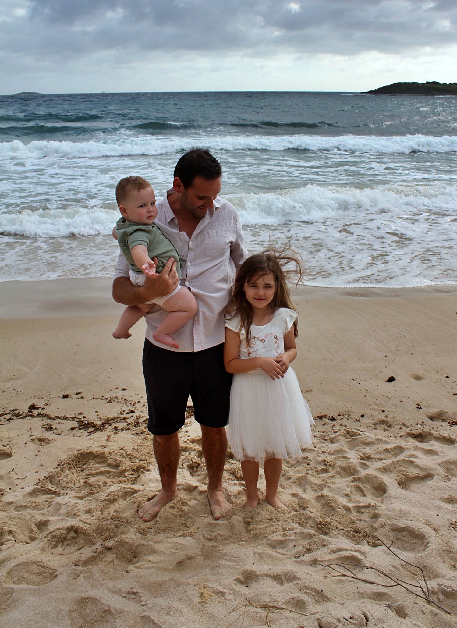 Natural beach portraits of dad with his daughter and son in the Illawarra.