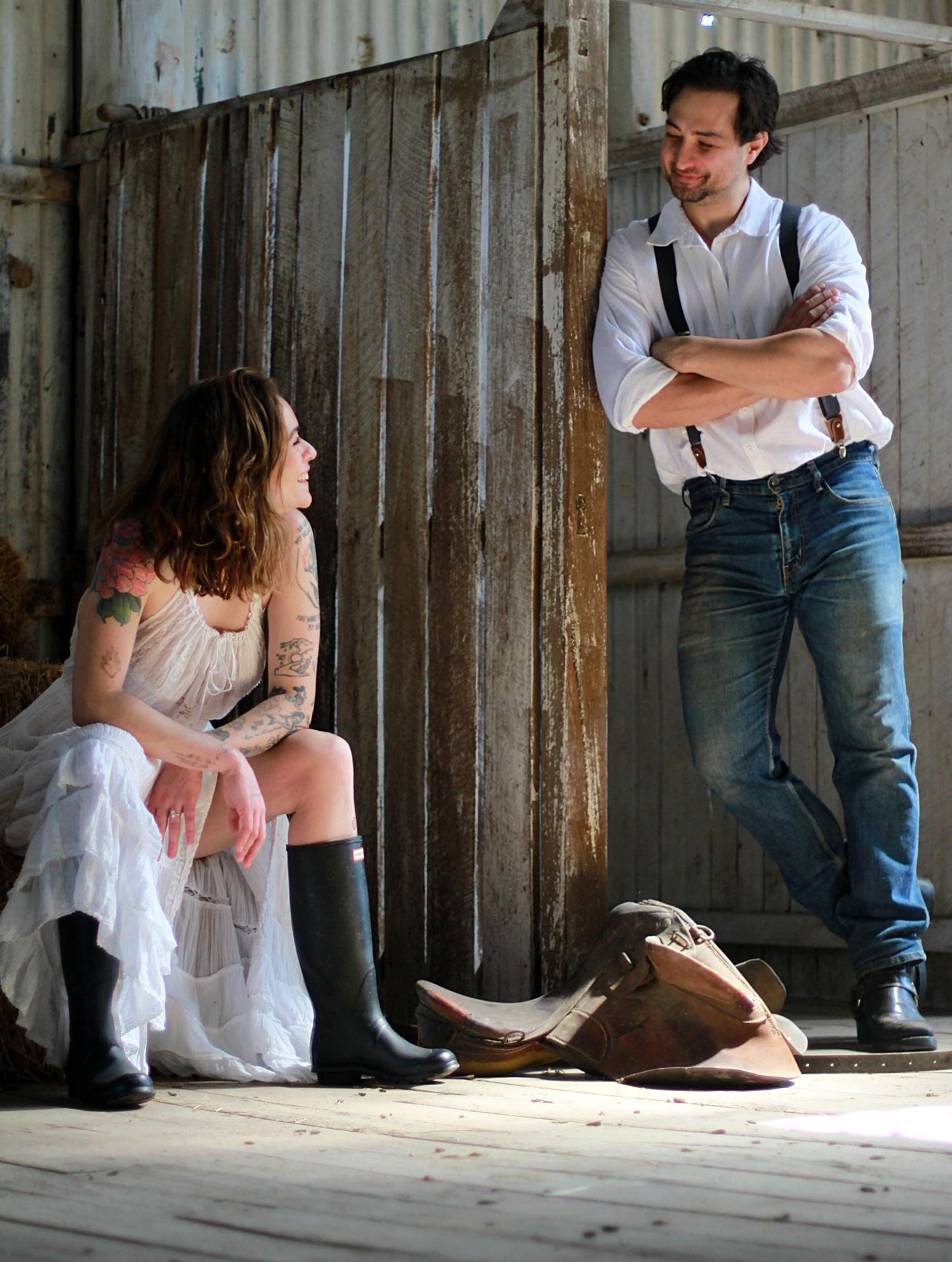 Country barn engagement capturing a couple sharing a quiet look