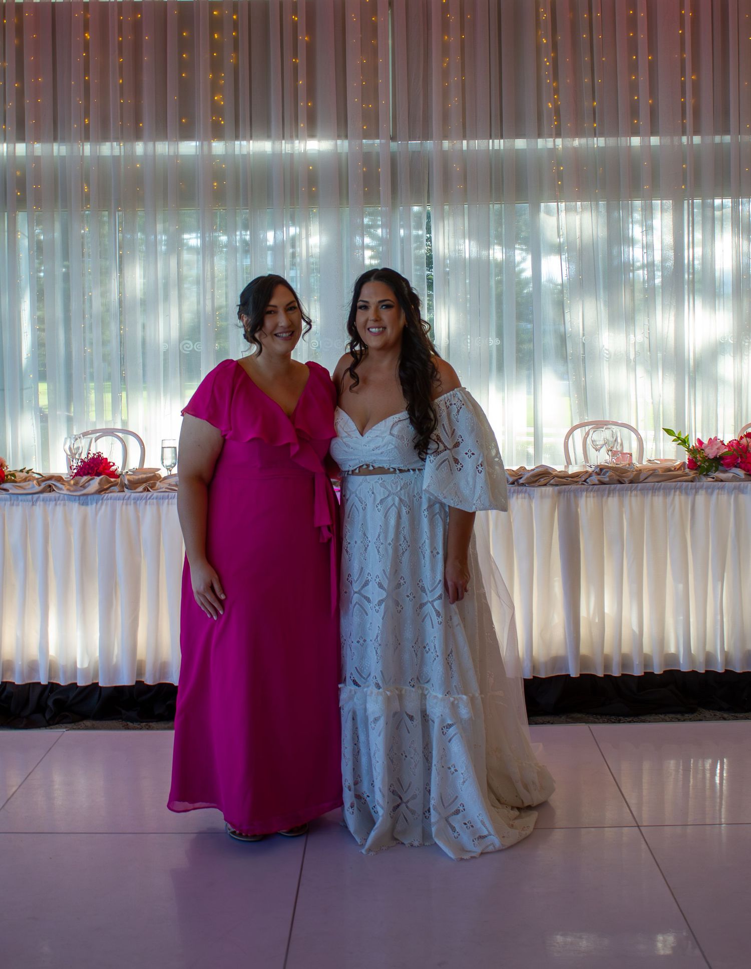 Portrait of the bride with her bridesmaid during wedding portraits, celebrating friendship on the wedding day.